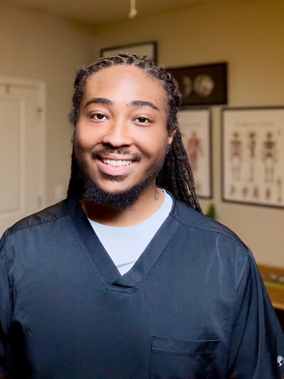 Tae&rsquo;Quan Matthews, licensed massage and bodywork therapist and founder of Eustress AVL